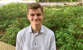 student Chris DeFelice sitting in the Quad