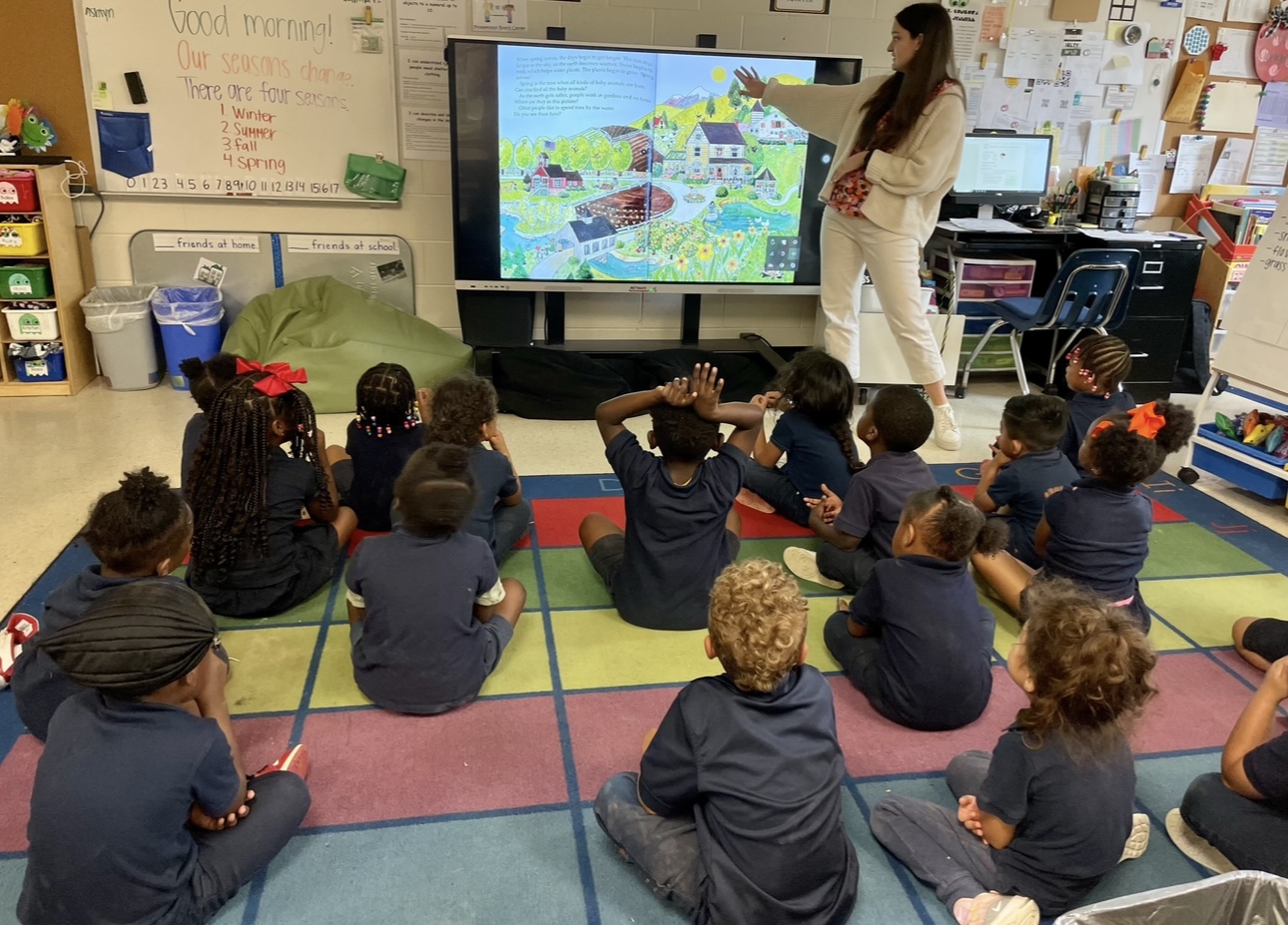 Caroline Hargrave teaching children in classroom.