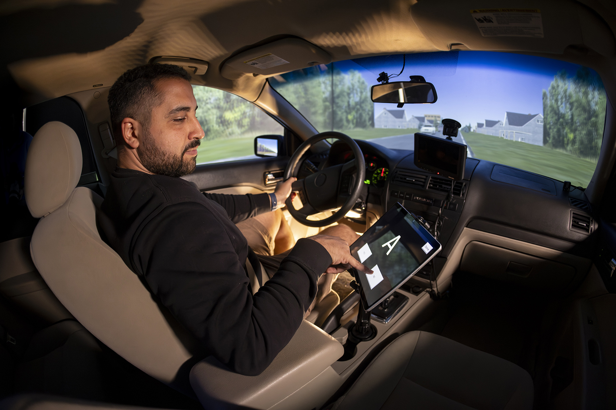 Researcher in driving simulator vehicle