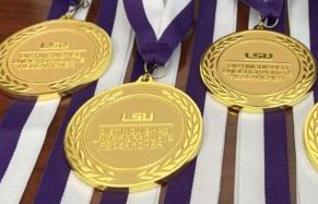 Distinguished undergraduate researcher medal laid on table.