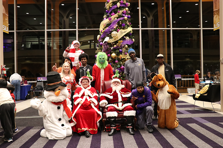 staff with Santa and Mrs. Claus