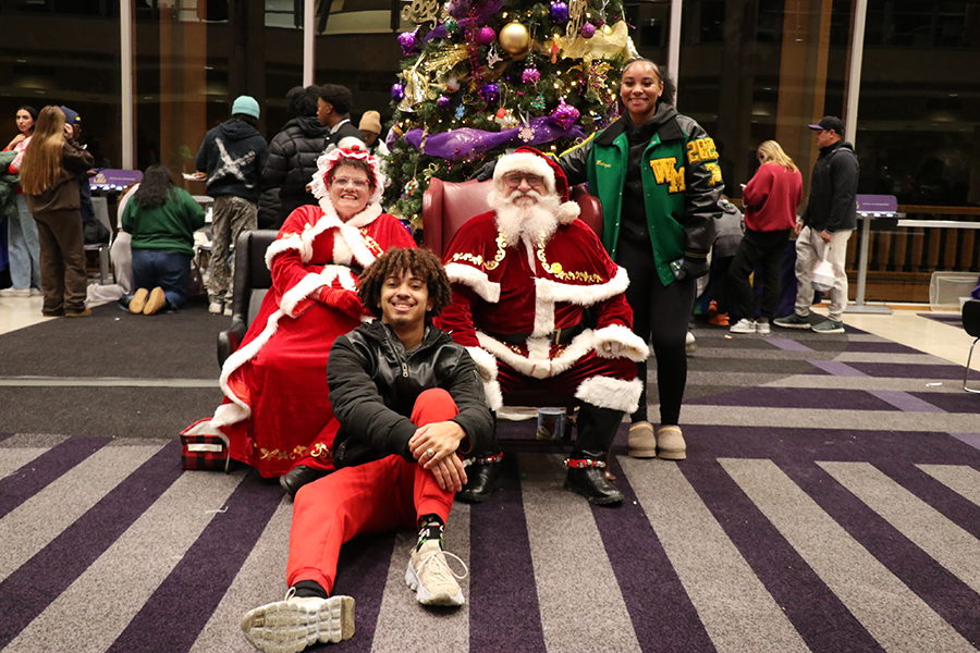 student with Santa and Mrs. Claus