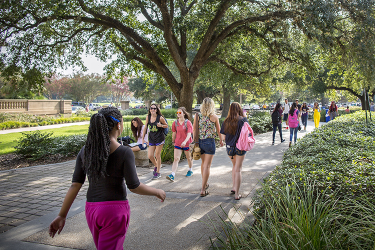 Photo of student walking on campus